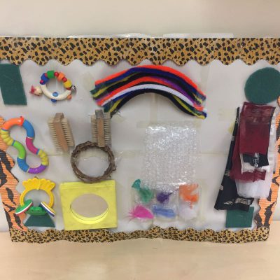 Sensory play board using a variety of items from home
